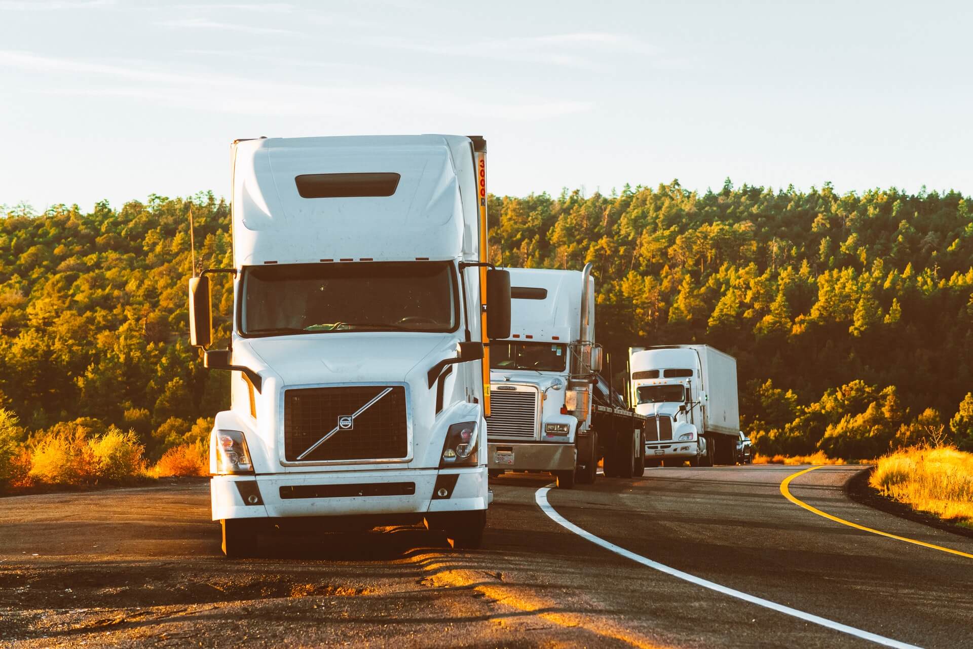 Photo of a man inspecting a truck for a vehicle inspection report
